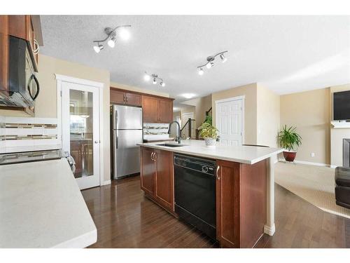 261 Martin Crossing Place Ne, Calgary, AB - Indoor Photo Showing Kitchen With Fireplace