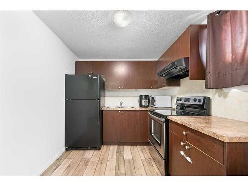 261 Martin Crossing Place Ne, Calgary, AB - Indoor Photo Showing Kitchen With Double Sink