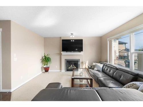 261 Martin Crossing Place Ne, Calgary, AB - Indoor Photo Showing Living Room With Fireplace