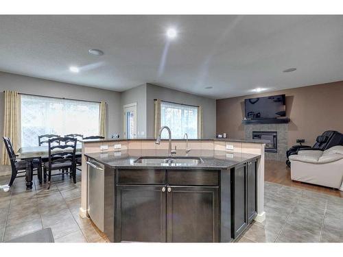 136 Cougartown Close Sw, Calgary, AB - Indoor With Fireplace