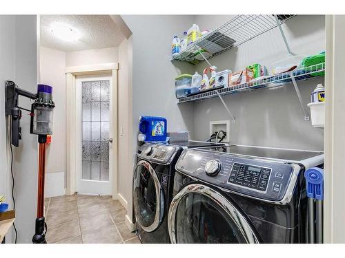 136 Cougartown Close Sw, Calgary, AB - Indoor Photo Showing Laundry Room