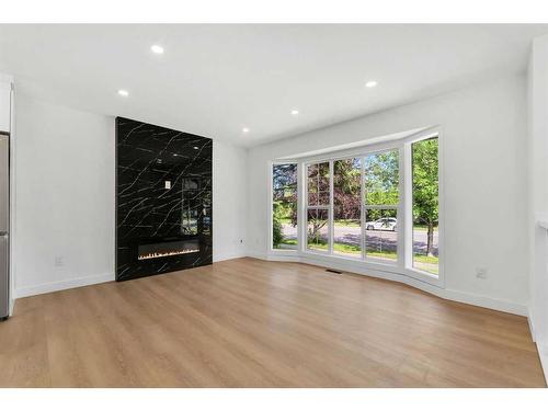 1035 Abbeydale Drive Ne, Calgary, AB - Indoor Photo Showing Living Room With Fireplace