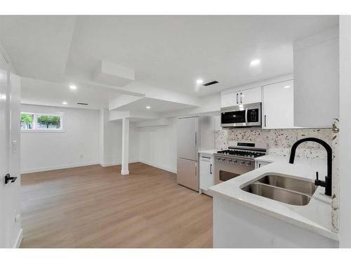 1035 Abbeydale Drive Ne, Calgary, AB - Indoor Photo Showing Kitchen With Double Sink