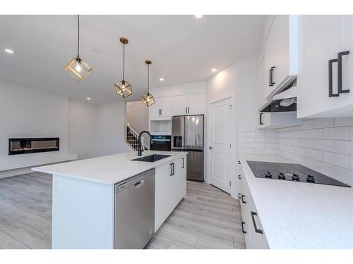 70 Cobbleridge Place Sw, Airdrie, AB - Indoor Photo Showing Kitchen With Stainless Steel Kitchen With Upgraded Kitchen