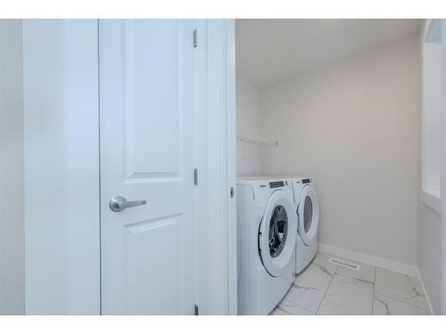 70 Cobbleridge Place Sw, Airdrie, AB - Indoor Photo Showing Laundry Room