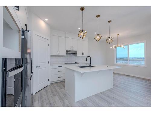 70 Cobbleridge Place Sw, Airdrie, AB - Indoor Photo Showing Kitchen With Upgraded Kitchen