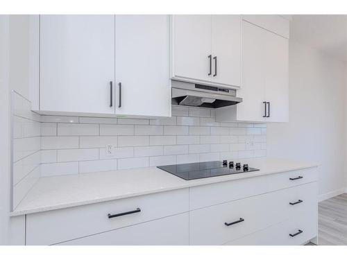 70 Cobbleridge Place Sw, Airdrie, AB - Indoor Photo Showing Kitchen With Upgraded Kitchen