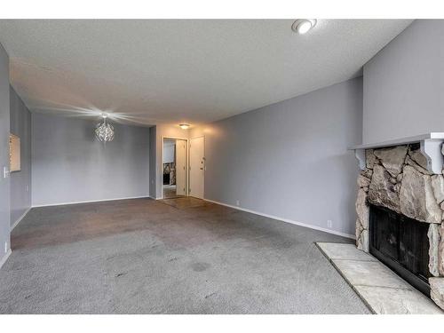 121-10120 Brookpark Boulevard Sw, Calgary, AB - Indoor With Fireplace