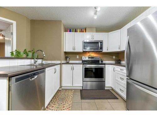 1212-16969 24 Street Sw, Calgary, AB - Indoor Photo Showing Kitchen With Stainless Steel Kitchen