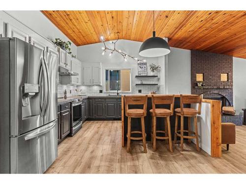 125 Woodbend Way, Okotoks, AB - Indoor Photo Showing Kitchen With Upgraded Kitchen