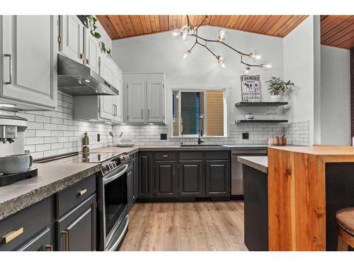 125 Woodbend Way, Okotoks, AB - Indoor Photo Showing Kitchen With Upgraded Kitchen