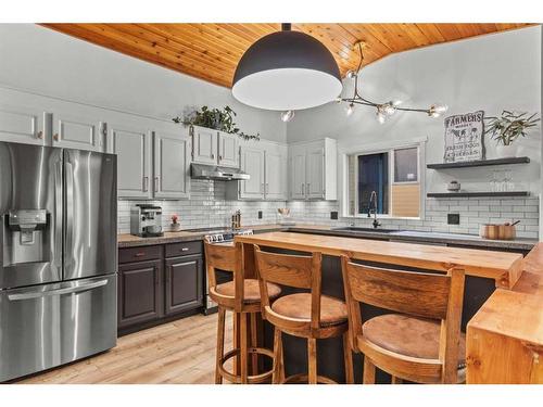 125 Woodbend Way, Okotoks, AB - Indoor Photo Showing Kitchen With Upgraded Kitchen