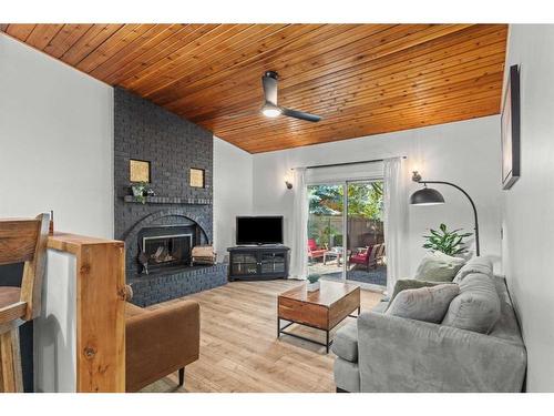 125 Woodbend Way, Okotoks, AB - Indoor Photo Showing Living Room With Fireplace