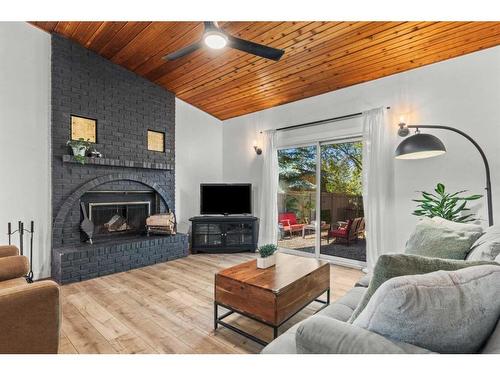 125 Woodbend Way, Okotoks, AB - Indoor Photo Showing Living Room With Fireplace