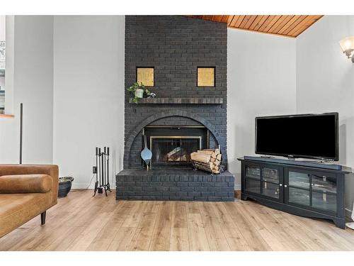 125 Woodbend Way, Okotoks, AB - Indoor Photo Showing Living Room With Fireplace