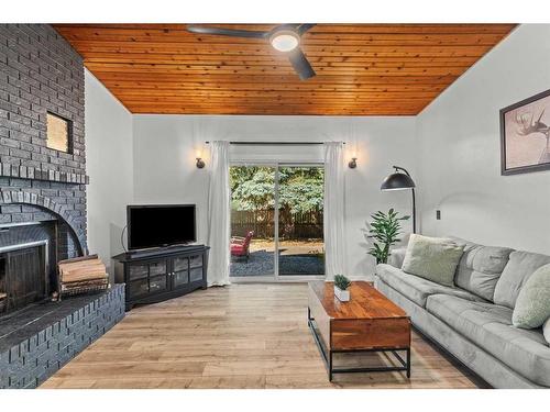 125 Woodbend Way, Okotoks, AB - Indoor Photo Showing Living Room With Fireplace