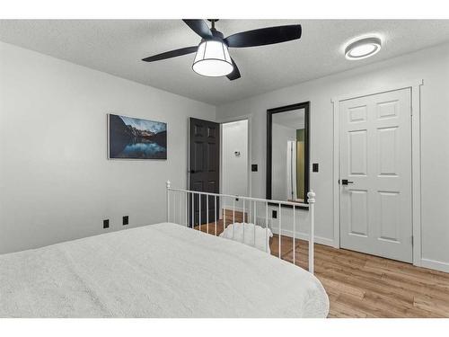 125 Woodbend Way, Okotoks, AB - Indoor Photo Showing Bedroom