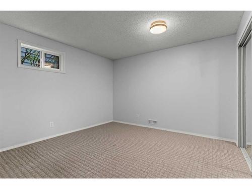 125 Woodbend Way, Okotoks, AB - Indoor Photo Showing Other Room