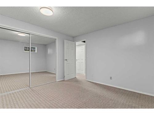 125 Woodbend Way, Okotoks, AB - Indoor Photo Showing Other Room