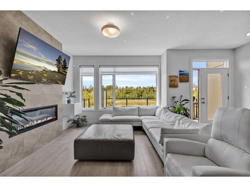 20 Royal Elm Green Nw, Calgary, AB - Indoor Photo Showing Living Room With Fireplace