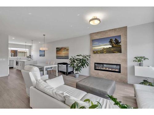 20 Royal Elm Green Nw, Calgary, AB - Indoor Photo Showing Living Room With Fireplace