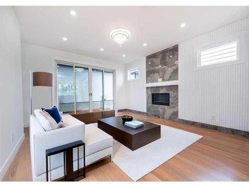 105 Hartford Road Nw, Calgary, AB - Indoor Photo Showing Living Room With Fireplace