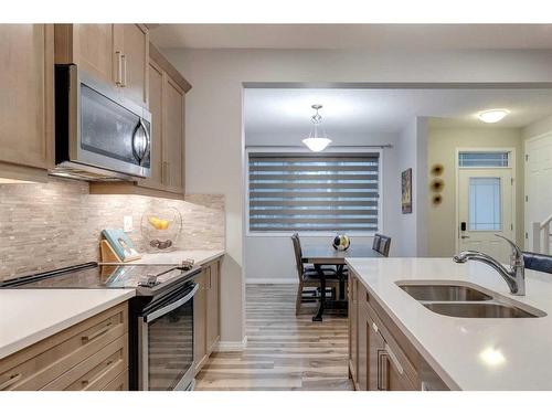 247 Carrington Circle Nw, Calgary, AB - Indoor Photo Showing Kitchen With Double Sink