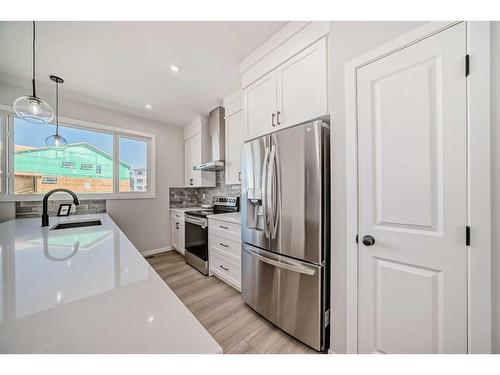 208 Lucas Place Nw, Calgary, AB - Indoor Photo Showing Kitchen With Stainless Steel Kitchen