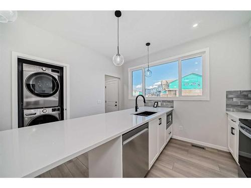 208 Lucas Place Nw, Calgary, AB - Indoor Photo Showing Kitchen With Double Sink