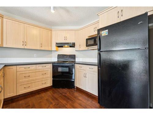 73 Rocky Ridge Heath Nw, Calgary, AB - Indoor Photo Showing Kitchen