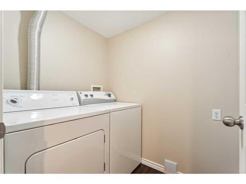 73 Rocky Ridge Heath Nw, Calgary, AB - Indoor Photo Showing Laundry Room