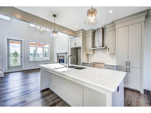 649 Cottageclub Bend, Rural Rocky View County, AB - Indoor Photo Showing Kitchen With Double Sink With Upgraded Kitchen