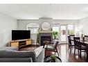 111-923 15 Avenue Sw, Calgary, AB  - Indoor Photo Showing Living Room With Fireplace 