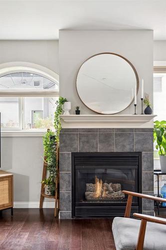 111-923 15 Avenue Sw, Calgary, AB - Indoor Photo Showing Living Room With Fireplace