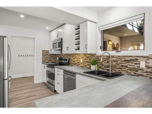 501 3 Street, Canmore, AB - Indoor Photo Showing Kitchen With Double Sink With Upgraded Kitchen