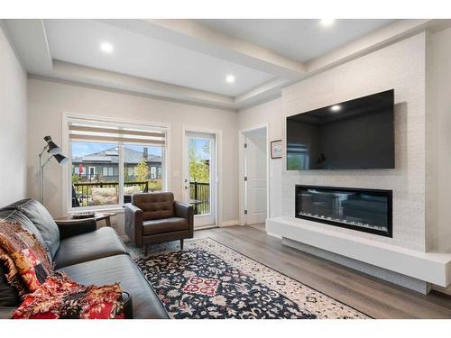 336 Marina Cove Se, Calgary, AB - Indoor Photo Showing Living Room With Fireplace