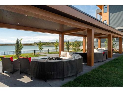 336 Marina Cove Se, Calgary, AB - Outdoor With Body Of Water With Deck Patio Veranda With Exterior