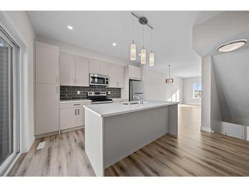 482 Canals Crossing Sw, Airdrie, AB - Indoor Photo Showing Kitchen With Upgraded Kitchen