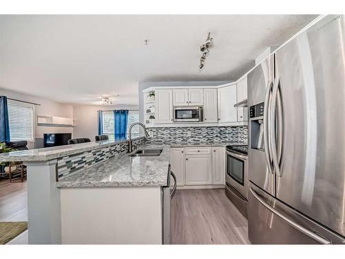 203-15320 Bannister Road Se, Calgary, AB - Indoor Photo Showing Kitchen With Double Sink With Upgraded Kitchen