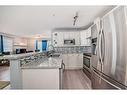 203-15320 Bannister Road Se, Calgary, AB  - Indoor Photo Showing Kitchen With Double Sink With Upgraded Kitchen 