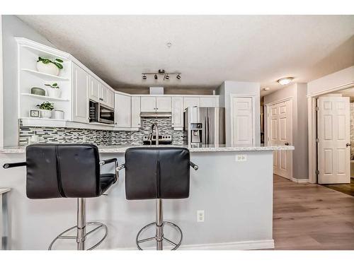 203-15320 Bannister Road Se, Calgary, AB - Indoor Photo Showing Kitchen With Upgraded Kitchen