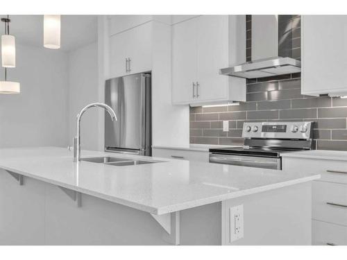 141 Corner Glen Way Ne, Calgary, AB - Indoor Photo Showing Kitchen With Double Sink With Upgraded Kitchen