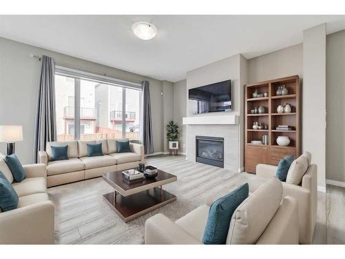 180 Cityside Park Ne, Calgary, AB - Indoor Photo Showing Living Room With Fireplace