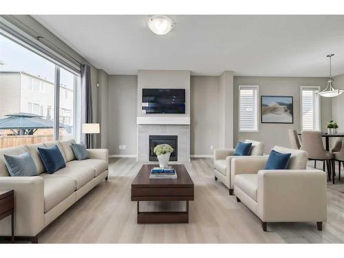 180 Cityside Park Ne, Calgary, AB - Indoor Photo Showing Living Room With Fireplace