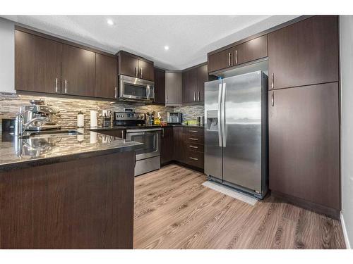 345 Windford Green Sw, Airdrie, AB - Indoor Photo Showing Kitchen With Upgraded Kitchen