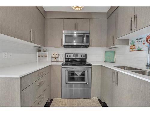 6203-302 Skyview Ranch Drive Ne, Calgary, AB - Indoor Photo Showing Kitchen With Stainless Steel Kitchen With Double Sink With Upgraded Kitchen