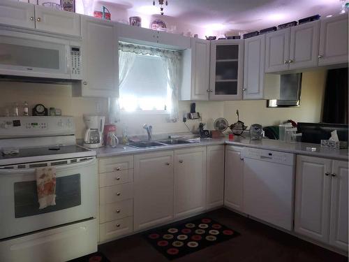 328 6 Avenue North, Champion, AB - Indoor Photo Showing Kitchen With Double Sink