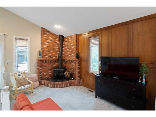 111 Edforth Place Nw, Calgary, AB - Indoor Photo Showing Living Room With Fireplace