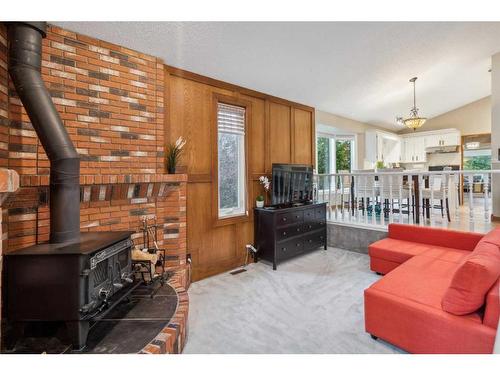 111 Edforth Place Nw, Calgary, AB - Indoor Photo Showing Living Room With Fireplace