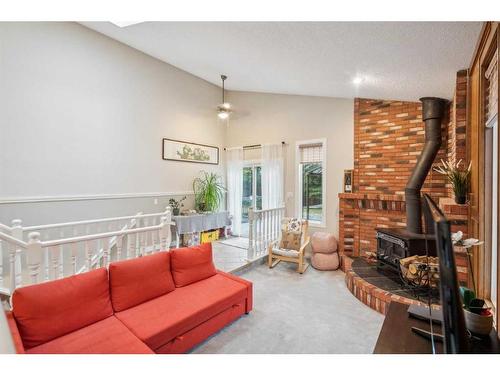 111 Edforth Place Nw, Calgary, AB - Indoor Photo Showing Living Room With Fireplace